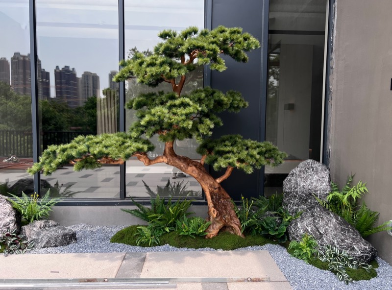 Artificial pine tree in modern courtyard
